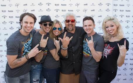 Guy Fieri with the cast of Rock of Ages. Credit- Erik Kabik