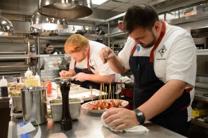 Executive Chef Jonah Resnick preparing dishes at Carbone grand opening party