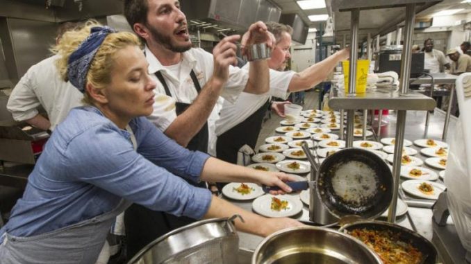 Local chefs and cooks line up dozens of plates as they prepare dinner at the Audubon Nature Institute's Gulf United for Lasting Fisheries (G.U.L.F.) dinner at the Aquarium of Americas in New Orleans on Thursday, September 24, 2015. (Photo by Chris Granger, Nola.com | The Times-Picayune)