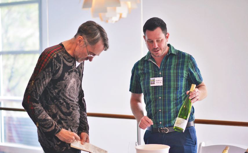 Stuart Pigott, author and international Riesling authority, listens to Matt Missick of Villa Bellangelo describe the winery’s 2014 Dry Riesling. Pigott was one of numerous industry professionals in attendance.