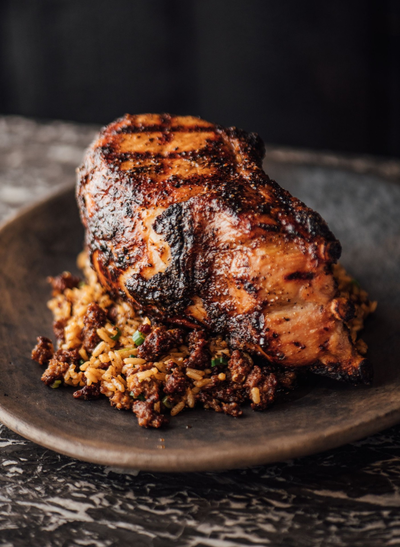 GRILLED DOUBLE-CUT PORK CHOP WITH CANE SYRUP GASTRIQUE